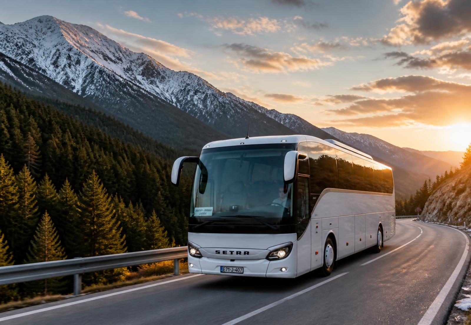 Touring coach on a European mountain highway at sunset